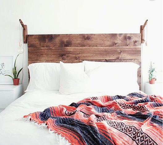 This simple DIY wooden headboard comes with easy directions that anyone can follow to make your bedroom nice and cozy!